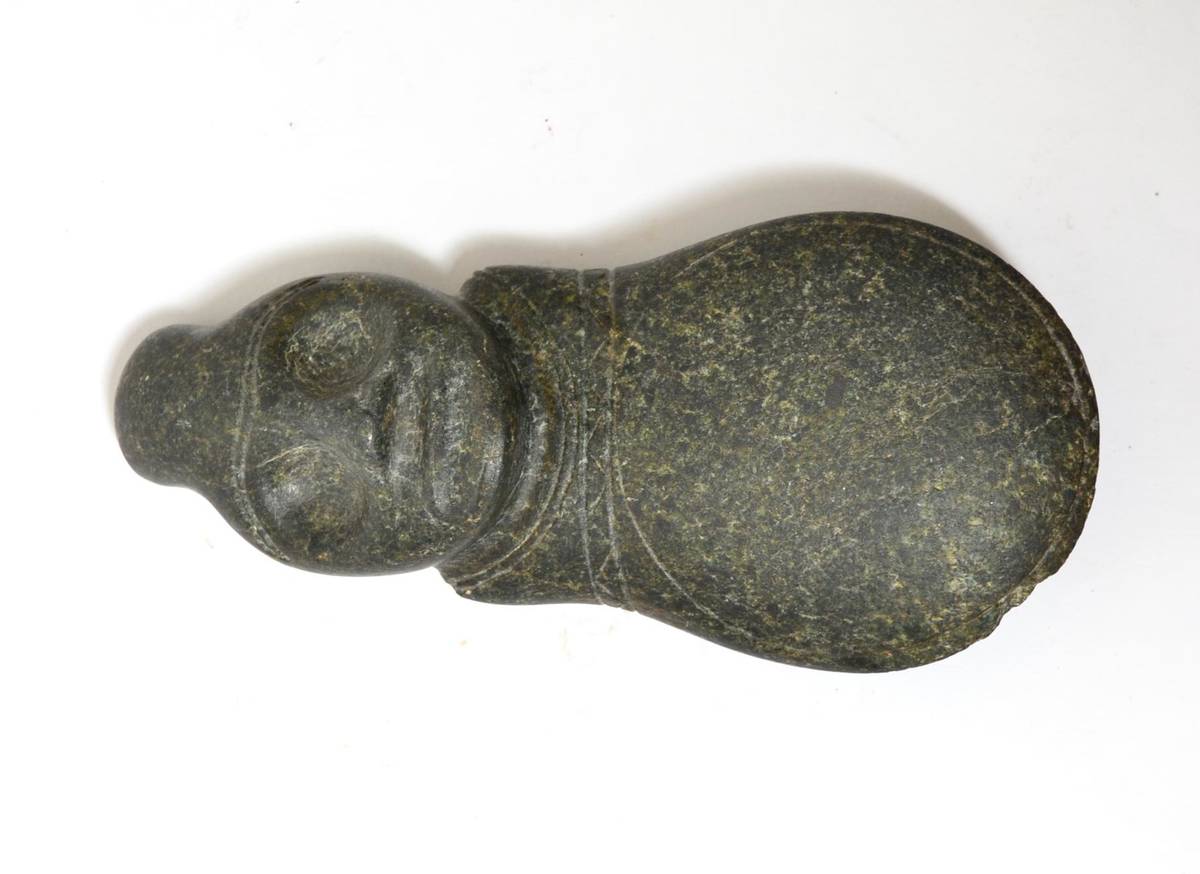 Lot 87 - A Taino carved green hardstone axe with head, 1000-1500AD, the head probably depicting a god or...