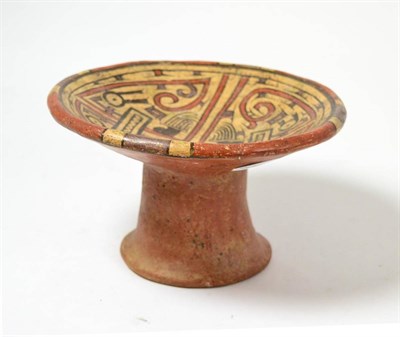 Lot 90 - A Pre-Columbian Coclé pedestal dish, circa 500-1000AD, painted with stylised faces, the top...
