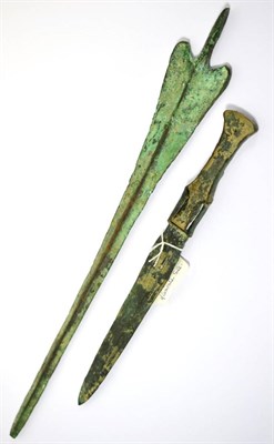 Lot 101 - A Luristan crescent hilt bronze age dagger, circa 800-1200BC, 27cm wide, with a Luristan age...