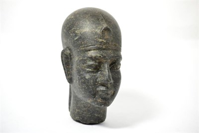 Lot 115 - An Egyptian carved serpentine head of a Pharaoh, 19th-20th century, carved in the round with...