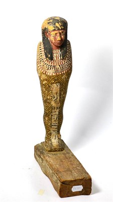 Lot 116 - A large Egyptian carved wooden and painted Ushabti, possibly New Kingdom, carved in the round...