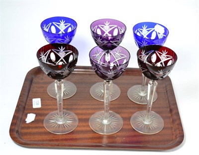 Lot 138 - A set of six coloured and cut glass hock glasses, 21cm high