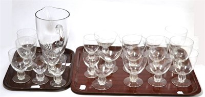Lot 142 - A suite of Lalique glass, comprising twenty glasses and a jug (two trays)