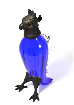 Lot 153 - A pewter mounted blue glass claret jug in the form of a parrot