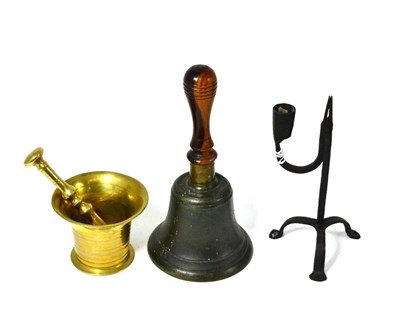 Lot 165 - A brass mortar and pestle, a 19th century iron rush light and a brass bell