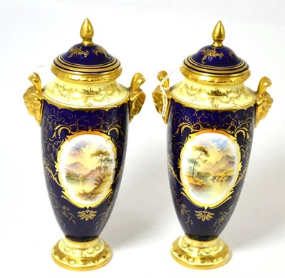 Lot 179 - A pair of Coalport twin-handled vases and covers, 25cm high, painted by Percy Simpson with...