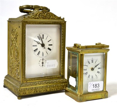 Lot 183 - A 19th century French alarum desk clock in anthemion cast brass case and a brass carriage timepiece