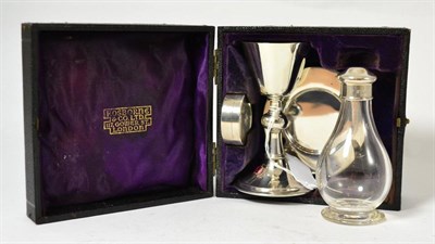 Lot 184 - A silver communion set in a fitted case labelled F Osborne & Co Limited 117 Tower Street, London