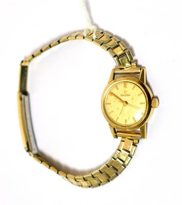 Lot 210 - A cased 9ct gold lady's Omega wristwatch with associated bracelet strap