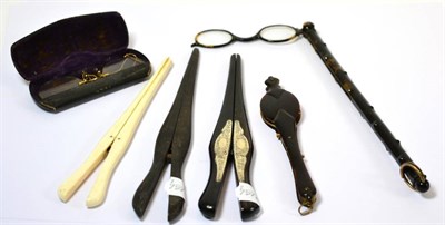 Lot 211 - Two pairs of ebonised glove stretchers, another Edwardian pair in ivory, two pairs of...