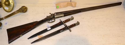 Lot 251 - A side by side percussion cap shotgun (deactivated) together with two bayonets (3)