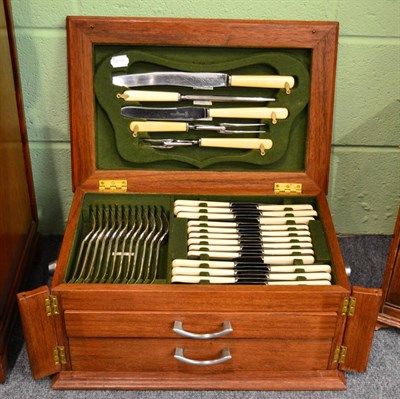 Lot 254 - An oak cased canteen of plated cutlery for twelve place settings