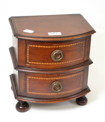 Lot 261 - A miniature inlaid mahogany bow front two drawer chest