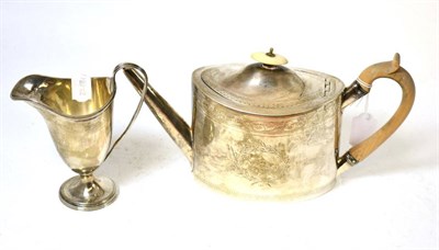 Lot 294 - A George III silver teapot together with a 19th century silver cream jug (2)