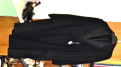 Lot 329 - An early 20th century gentlemen's dinner jacket, frock coat and patent shoes etc