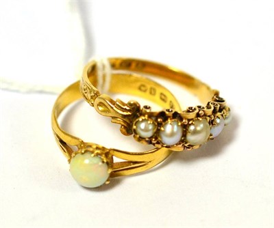 Lot 331 - A 22ct gold ring set with a round cabochon opal and an 18ct gold split pearl five stone ring (2)