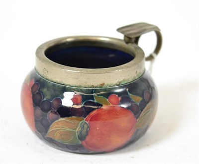 Lot 398 - A William Moorcroft Pomegranate pattern ash bowl, with metal mounted rim and cigarette holder,...