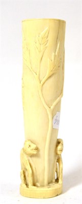 Lot 403 - An early 20th century African carved ivory vase decorated with monkeys