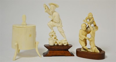 Lot 408 - A Meiji period carved ivory figure of a man and monkey together with a Japanese carved ivory figure