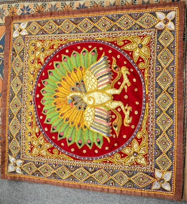 Lot 435 - A decorative Middle Eastern wall hanging, the central motif of a peacock decorated with...