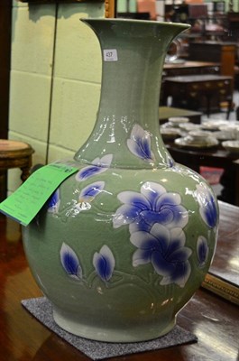 Lot 437 - A large 20th century Chinese Jingdezhen green orchid vase with impressed calligraphy to body