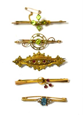 Lot 459 - A group of five Victorian and Edwardian bar brooches including a 9ct gold ruby and seed pearl...