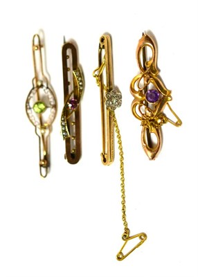 Lot 460 - A group of four Edwardian bar brooches including a 9ct gold amethyst set brooch, 9ct gold...