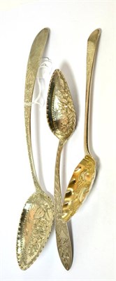 Lot 483 - Three silver berry spoons, one London George III, one German and one marked Burgari (3)