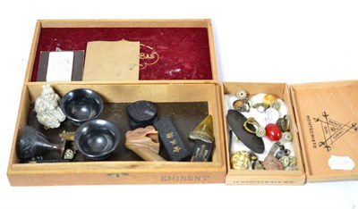 Lot 494 - Two small wooden boxes including collectable items, bisque seated Buddha, bone mask, etc