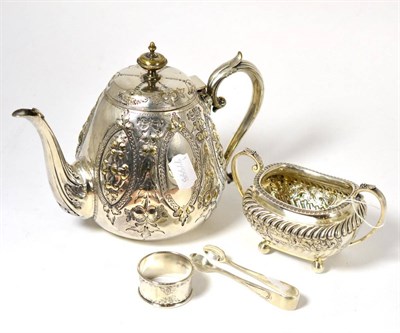 Lot 508 - A silver two handled sugar basin, Sheffield, silver napkin ring, plated teapot and sugar tongs