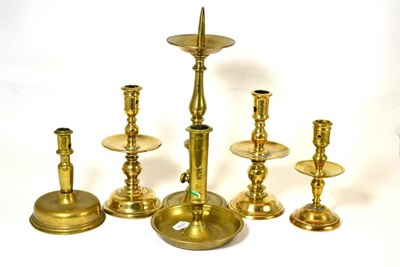 Lot 510 - Three 17th century Dutch Heemskerk candlesticks, a Spanish brass candlestick, a Spanish bell...