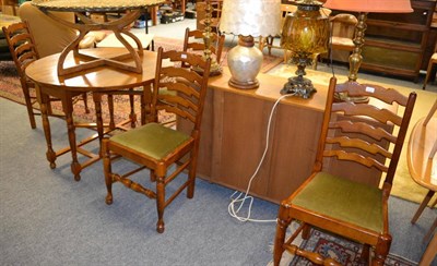 Lot 1016 - A modern drop leaf table and four chairs