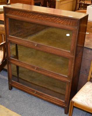 Lot 1025 - An early 20th century Globe Wernicke style oak three section bookcase and an Edwardian mahogany tub