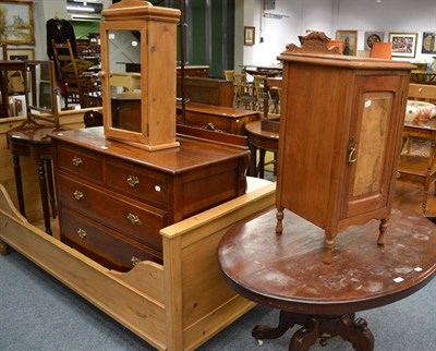 Lot 1040 - A Victorian mahogany loo table, a three height mahogany chest of drawers, a pot cupboard and a pine