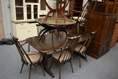 Lot 1061 - An Ercol dining suite comprising: table, six chairs and dresser and rack, together with a small...