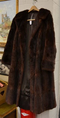 Lot 1064 - A brown musquash fur coat