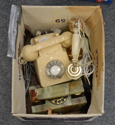 Lot 1095 - Three rotary dial telephones including ivory coloured and onyx