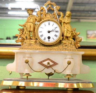 Lot 1242 - A French gilt metal mounted figural mantle clock on an alabaster plinth base