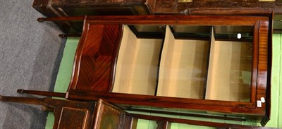 Lot 1255 - A serpentine fronted mahogany glazed display cabinet