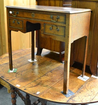 Lot 1260 - A 19th century oak lowboy