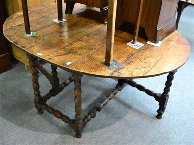 Lot 1261 - A 19th century gateleg dining table