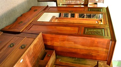 Lot 1263 - A mahogany mirror fronted wardrobe with carved panels