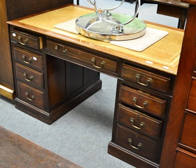 Lot 1289 - A leather inset twin pedestal desk