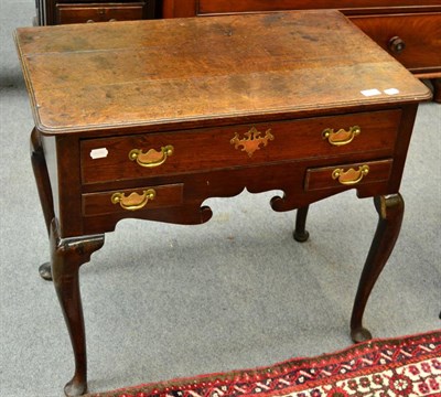 Lot 1290 - A 18th century oak lowboy