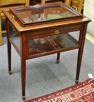 Lot 1293 - A 19th century brass mounted mahogany bijouterie table with integral twin handled glass...