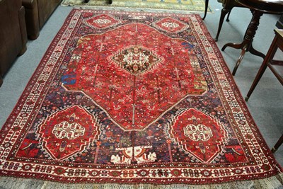 Lot 1295 - Kashgai carpet, South West Persia, The strawberry filed of zoomorphic motifs and stylised plant...