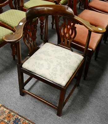 Lot 1314 - A 19th century mahogany corner elbow chair with twin carved splats