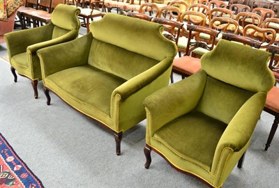 Lot 1315 - A late 19th/early 20th century green upholstered sofa and a pair of armchairs