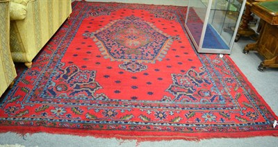 Lot 1335 - An Ushak carpet, West Central Anatolia, The tomato red field of stellar devices around a...