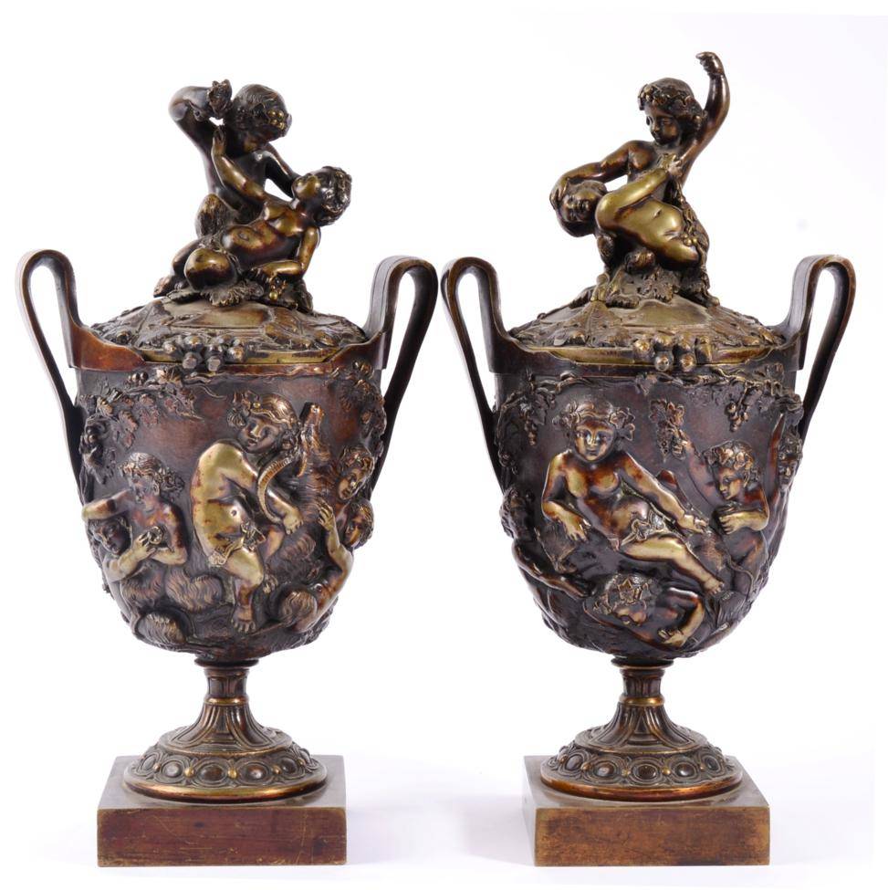 Lot 6 - A Pair of Bronze Twin-Handled Urn Shaped Vases and Covers, after the Antique, cast with...